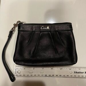 Coach smooth black wristlet.